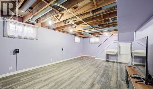 Below grade area with light wood-type flooring and baseboards - 14 Grandview Street, Brantford, ON - Indoor Photo Showing Basement