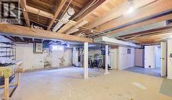 Below grade area featuring heating unit and electric panel - 