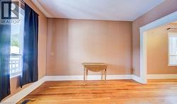 Spare room featuring wood-type flooring - 