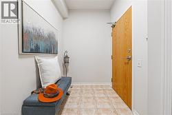 Welcoming, foyer featuring a hall closet and convenient laundry area - 