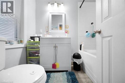 Full bathroom featuring vanity and bathtub / shower combination - 106 Lottridge Street, Hamilton, ON - Indoor Photo Showing Bathroom