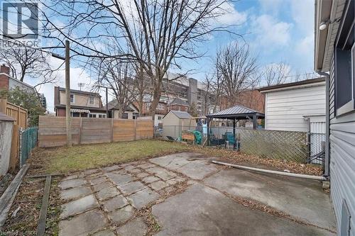 Fenced backyard featuring a gazebo, a patio area, and a residential view - 106 Lottridge Street, Hamilton, ON - Outdoor