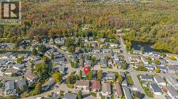 Aerial view of property's location featuring nearby suburban area and a nearby body of water - 