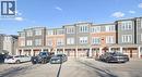 View of property featuring uncovered parking - 24 Morrison Road Unit# D9, Kitchener, ON  - Outdoor With Facade 