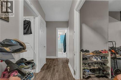 Corridor with dark wood-type flooring and baseboards - 70 Ottawa Street N, Hamilton, ON - Indoor Photo Showing Other Room