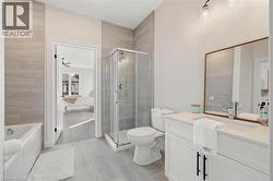 Bathroom featuring vanity, a shower stall, connected bathroom, and a bath - 