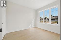 Unfurnished bedroom with light wood-type flooring and a closet - 