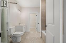 Bathroom featuring vanity and a bath - 