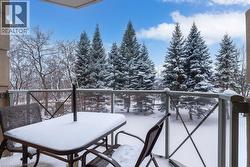 View of snow covered back of property - 