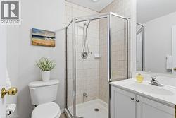 Full bath featuring vanity and a shower stall - 