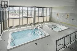 View of pool featuring a city view and a sunroom - 