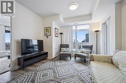 Living area with wood finished floors and baseboards - 