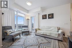 Living room with wood finished floors and baseboards - 