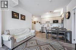 Living room featuring light wood-style flooring - 