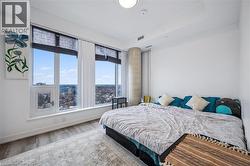 Bedroom with wood finished floors and baseboards - 