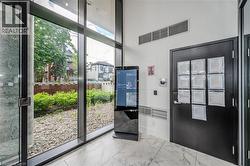 Entryway featuring marble look tiles and baseboards - 