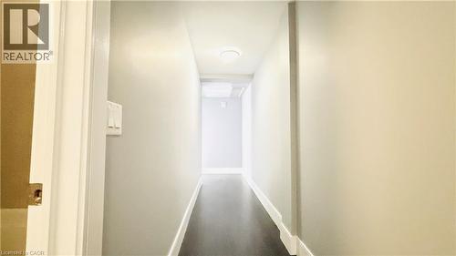 Corridor with baseboards - 155 St. Leger Unit# 107, Kitchener, ON - Indoor Photo Showing Other Room