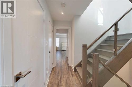 Hallway with dark wood-type flooring, stairway, and recessed lighting - 588 Rapids Lane, Mississauga, ON - Indoor Photo Showing Other Room