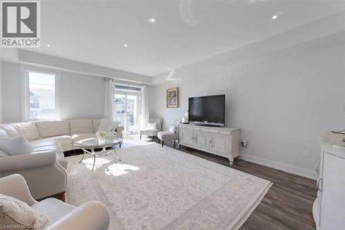 Living area with dark wood-style floors and recessed lighting - 588 Rapids Lane, Mississauga, ON - Indoor Photo Showing Living Room