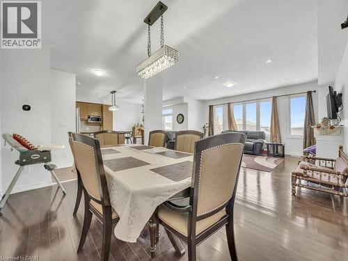 Dining room with dark wood finished floors, plenty of natural light, and recessed lighting - 3 Creighton Avenue, Guelph, ON - Indoor Photo Showing Dining Room