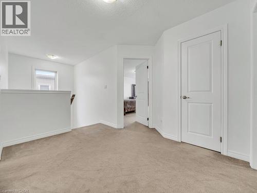 Unfurnished room with light carpet and a textured ceiling - 3 Creighton Avenue, Guelph, ON - Indoor Photo Showing Other Room