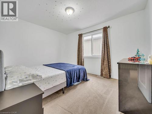 Bedroom featuring light colored carpet and baseboards - 3 Creighton Avenue, Guelph, ON - Indoor Photo Showing Bedroom