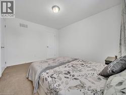 Bedroom featuring carpet and baseboards - 