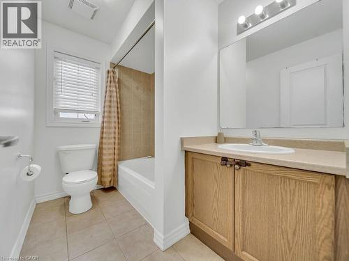 Bathroom featuring vanity, light tile patterned floors, and shower / tub combo - 3 Creighton Avenue, Guelph, ON - Indoor Photo Showing Bathroom