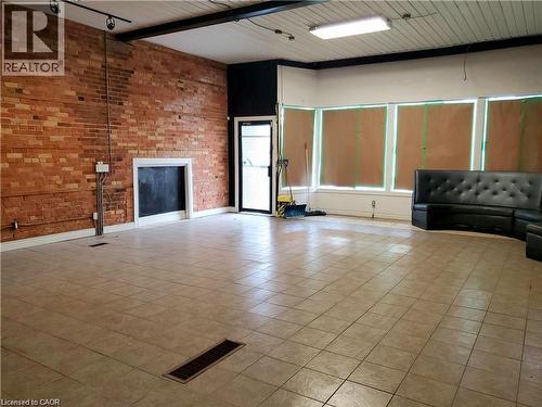 Unfurnished living room with tile patterned floors - 774 Barton Street E, Hamilton, ON 