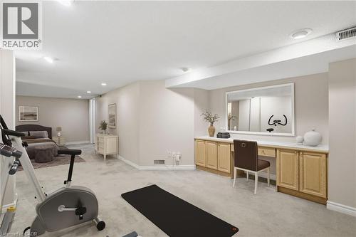 Virtually staged basement Bedroom/Den, exercise room and featuring light carpet and recessed lighting - 3230 New Street Unit# 7, Burlington, ON - Indoor Photo Showing Gym Room