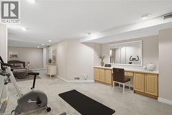 Virtually staged basement Bedroom/Den, exercise room and featuring light carpet and recessed lighting - 
