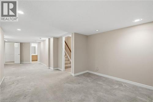 Finished basement with recessed lighting, carpet flooring, and stairway - 3230 New Street Unit# 7, Burlington, ON - Indoor Photo Showing Other Room