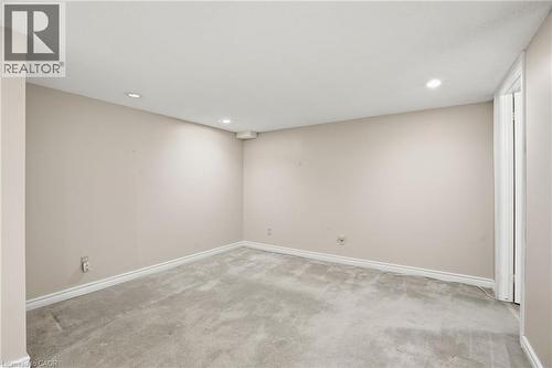 Empty room with light carpet and recessed lighting - 3230 New Street Unit# 7, Burlington, ON - Indoor Photo Showing Other Room