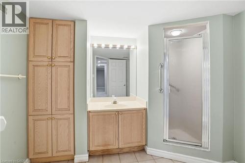 Bathroom with vanity, a stall shower, and light tile patterned flooring - 3230 New Street Unit# 7, Burlington, ON - Indoor Photo Showing Bathroom