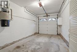 Garage featuring a central vacuum unit and a garage door opener - 