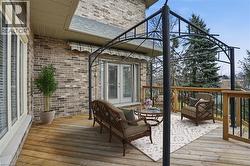 Deck with french doors and an outdoor hangout area - 