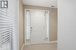 Entryway featuring baseboards window - 