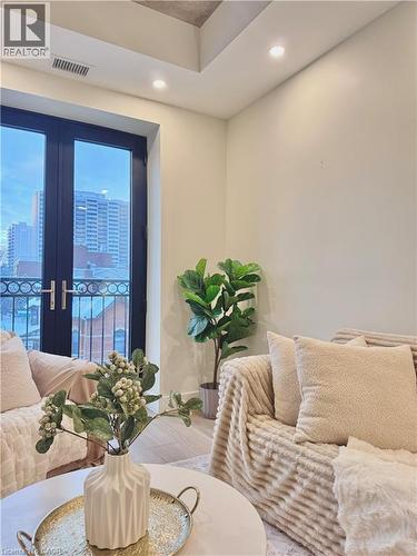 LIVING ROOM WITH JULIET BALCONY (WEST FACING) - 169 James Street S Unit# 401, Hamilton, ON - Indoor