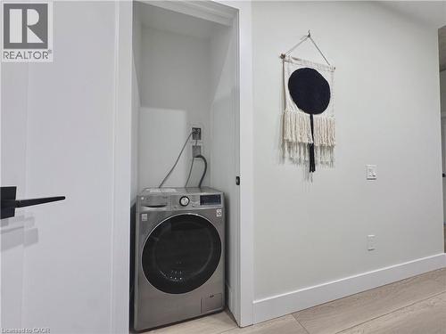 LG WASHER/DRYER COMBO ALL-IN-ONE - 169 James Street S Unit# 401, Hamilton, ON - Indoor Photo Showing Laundry Room