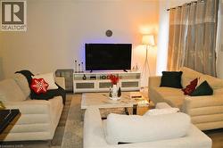 Living room featuring wood finished floors - 