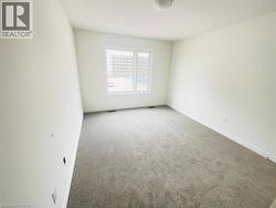 Empty room with carpet and baseboards - 