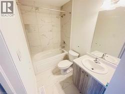 Full bath with vanity, shower / washtub combination, and light marble finish floors - 
