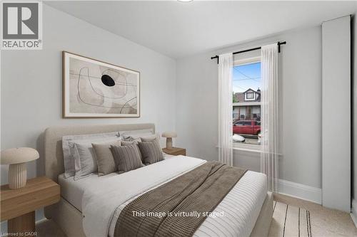 Main Floor Bedroom (Virtually Staged) - 159 Hope Avenue, Hamilton, ON - Indoor Photo Showing Bedroom