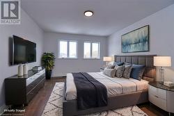 Bedroom featuring dark hardwood / wood-style flooring - 