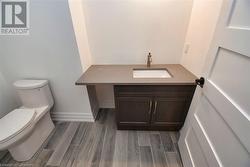 Bathroom with vanity and toilet - 