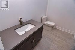 Bathroom featuring vanity and toilet - 