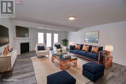 Living room featuring wood-type flooring and french doors - 