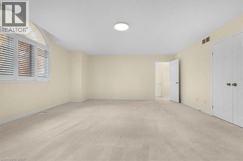 other view of primary bedroom with walk in closet to right and 5 piece ensuite bath - 90 Westlawn Drive, Hamilton, ON - Indoor