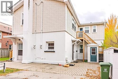 Back of house with stucco siding and an outdoor structure - 172 Markland Street, Hamilton, ON - Outdoor