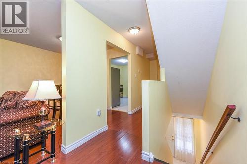 Corridor with an upstairs landing and wood finished floors - 85 Enmount Drive, Brampton, ON - Indoor Photo Showing Other Room